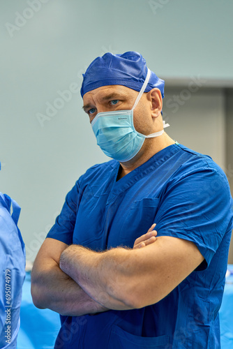 Asian surgeons work in a modern operating room