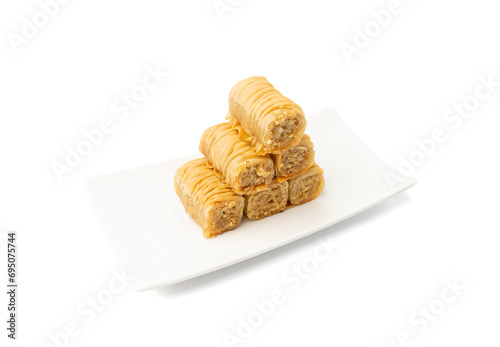 Rolled Baklava Isolated, Ramadan Dessert Roll on Restaurant Plate, Eastern Sweet Pastries photo