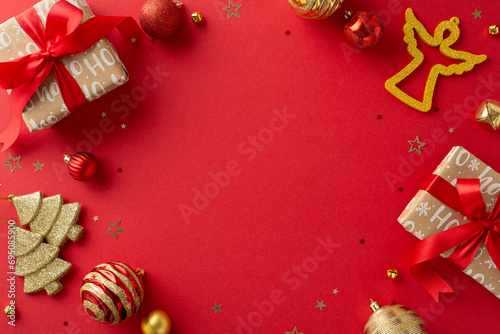 Delight and merrymaking in Season's Greetings postcard theme. Top view of polished gift boxes, baubles, angel toy, golden confetti on cheerful red background, shaping space for personalized wishes photo