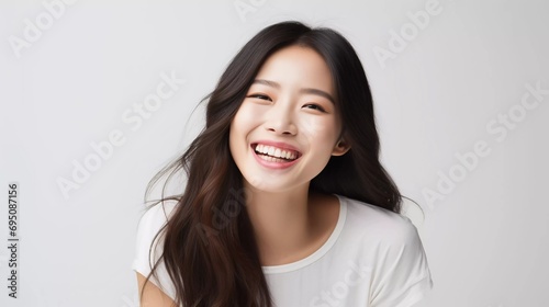 professional studio photo of beautiful young white Japanese female model with perfectly clean teeth with laughing expression, isolated white background
