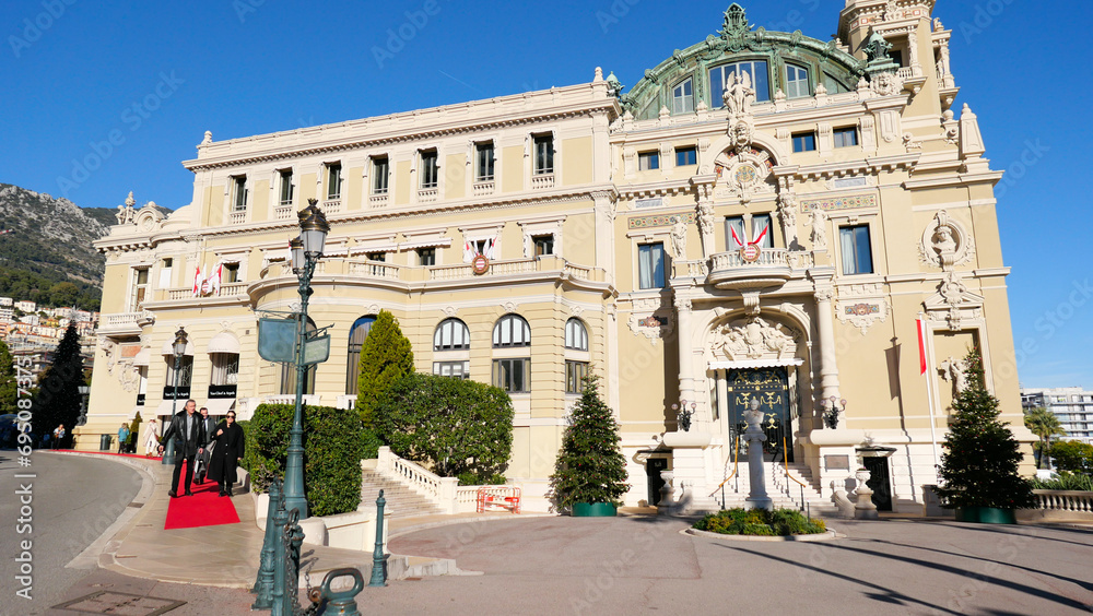 Fototapeta premium Stunning summer view of Monaco's iconic buildings next to the casino. Architectural elegance meets vibrant summer life, capturing the essence of luxury and charm in this Mediterranean gem.
