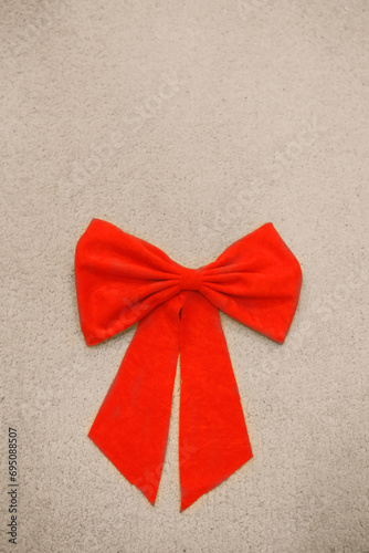 Red bow on a light background