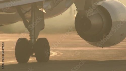 Turbine engine of passenger plane in operation before takeoff photo