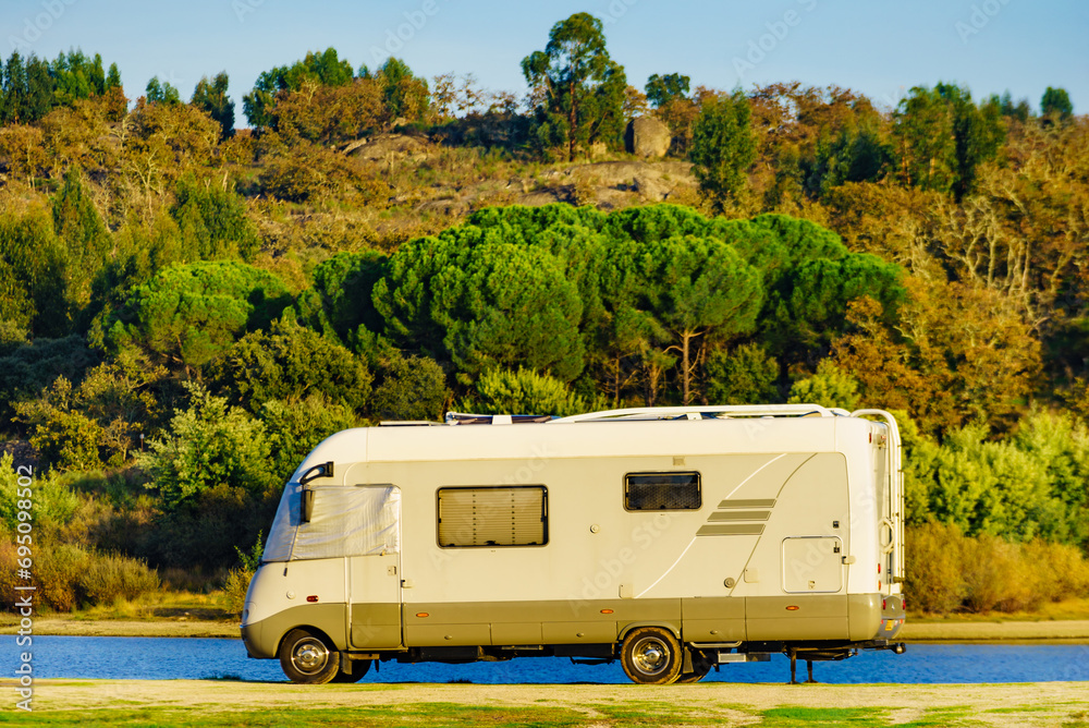 Rv caravan on lake shore. Autumn time.