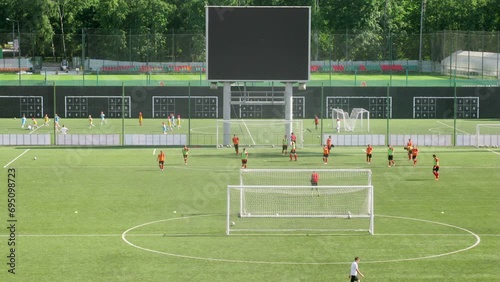 Football team play at the stadium at day. Time lapse. photo