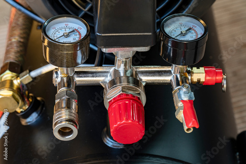 Pressure gauges, pressure measuring couplings in air compressor , measuring instrument on pneumatic control system. Pressure differential gauge
