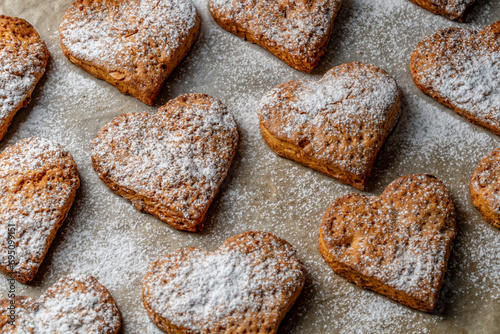 Home made heart shaped shortbread cookies on baking tray