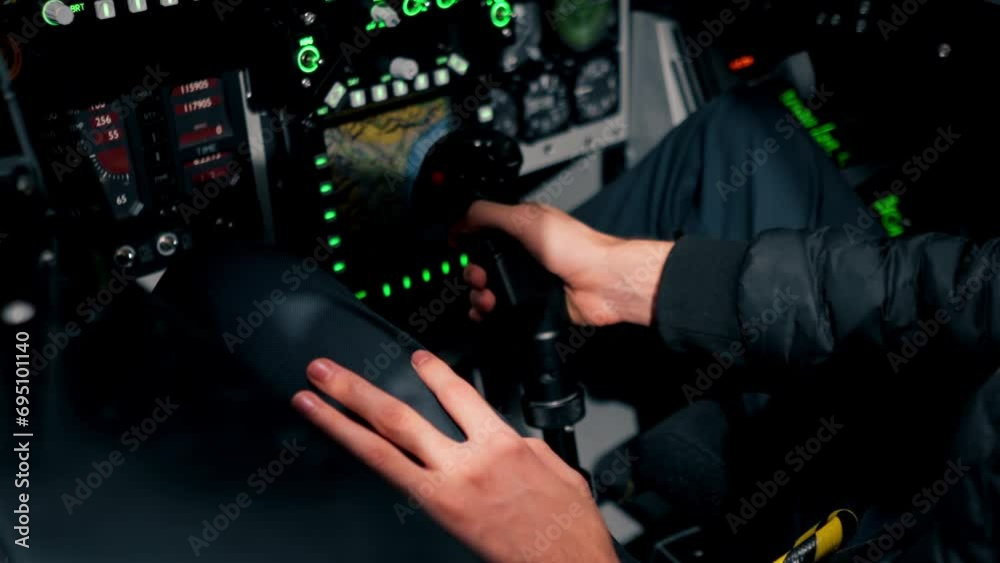 Pilot Operating Button close-up of the cockpit of a military plane a pilot with a steering ...