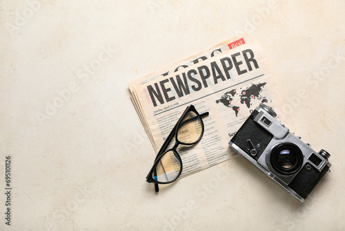 Newspaper with eyeglasses a...