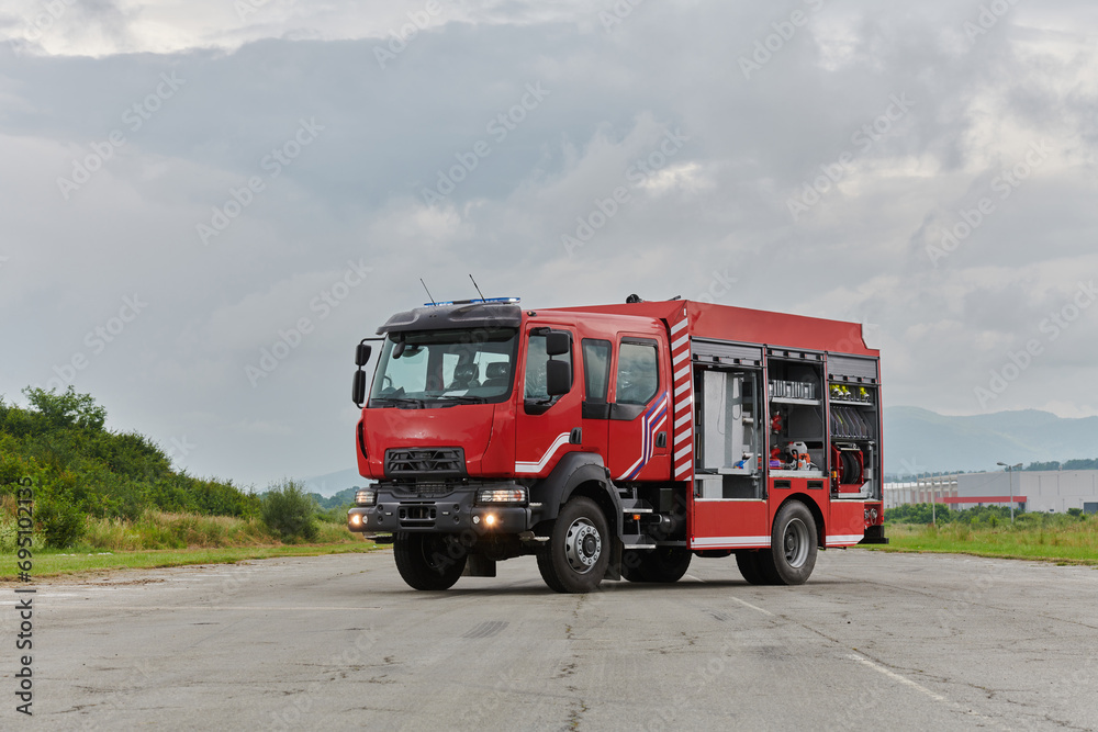 In this captivating scene, a state-of-the-art firetruck, equipped with advanced rescue technology, stands ready with its skilled firefighting team, prepared to intervene and respond rapidly to