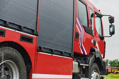 In this captivating scene, a state-of-the-art firetruck, equipped with advanced rescue technology, stands ready with its skilled firefighting team, prepared to intervene and respond rapidly to