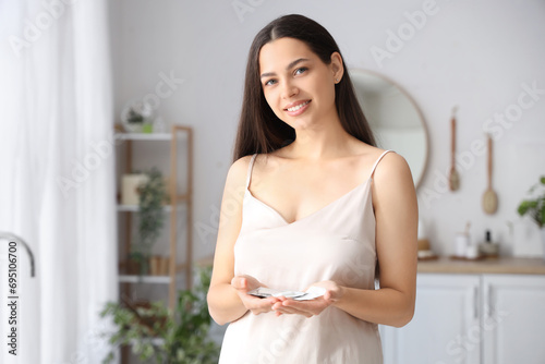 Young woman with contracept...