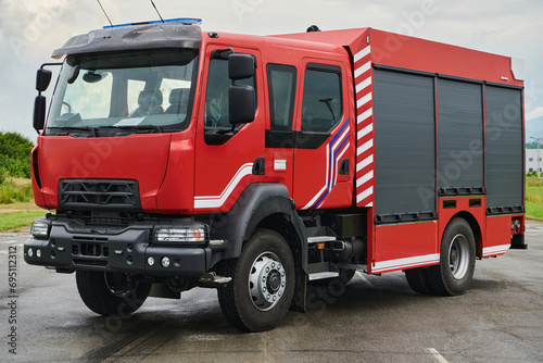 In this captivating scene, a state-of-the-art firetruck, equipped with advanced rescue technology, stands ready with its skilled firefighting team, prepared to intervene and respond rapidly to