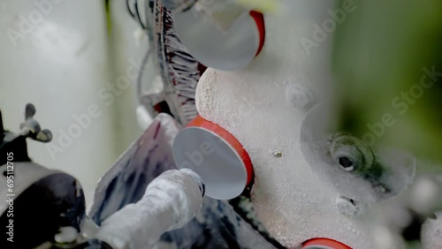The moment when the interiors of cans are polished in a fully automated beverage can manufacturing plant