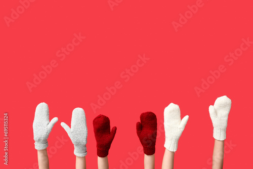 Children's hands in red and...
