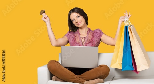 happy young woman hold bags after shopping