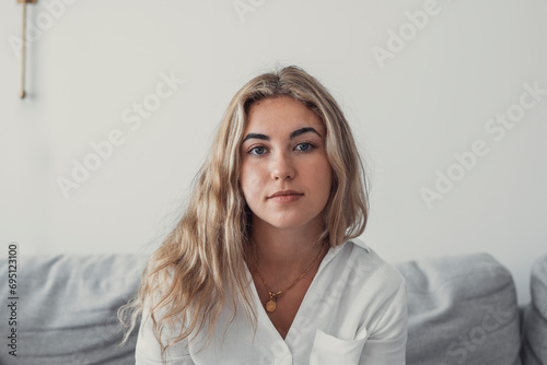 Obraz na plátně Positive serious millennial model girl home female head shot portrait