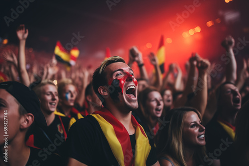 Belgian fans cheering on their team from the stands
