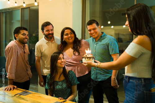 Latin women and men celebrathing a birthday party photo