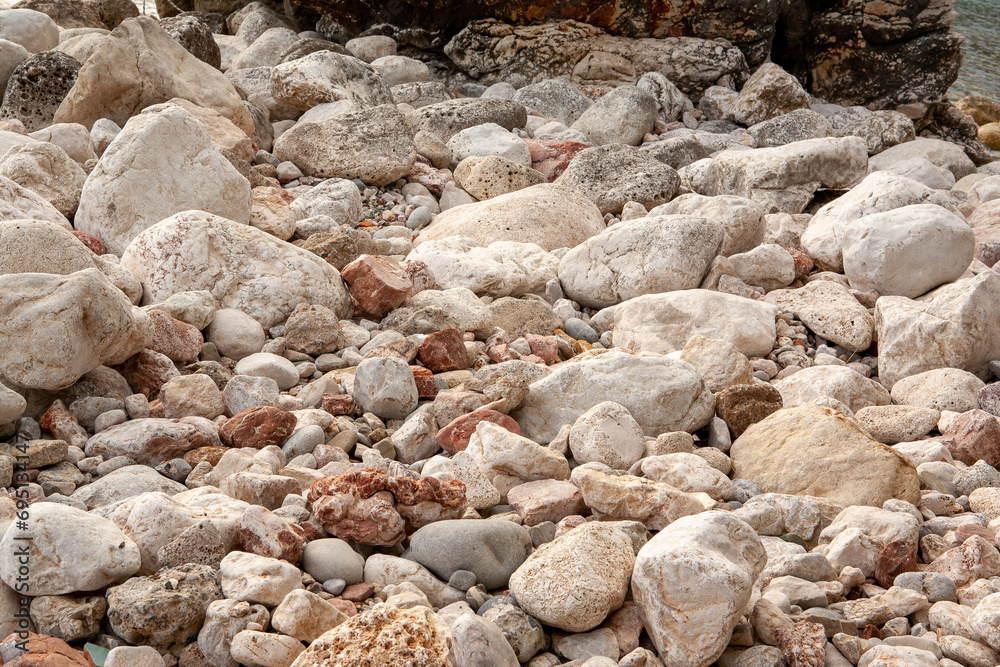 Background from large and small stones, close-up. Stone beach for publication, poster, calendar, post, screensaver, wallpaper, postcard, banner, cover, website. High quality photo Background from large and small stones, close-up. Stone beach for publication, poster, calendar, post, screensaver, wallpaper, postcard, banner, cover, website. High quality photo