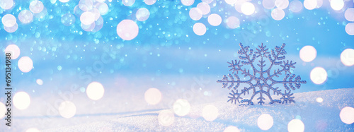 Christmas winter background, banner - view of decorative snowflake in sparkling snow, copy space for text
