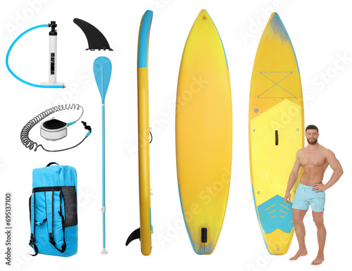 Photography Happy man with SUP board and different equipment for stand up paddle boarding is