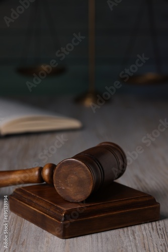 Law concept. Judge's gavel on light wooden table, closeup