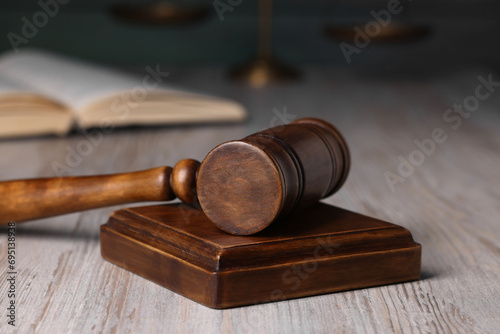 Law concept. Judge's gavel on light wooden table, closeup