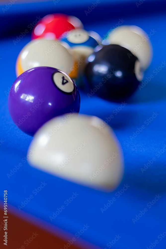 Close-up of Billiard Balls on Bright Blue Felted Pool Table, vertical Close-up of Billiard Balls on Bright Blue Felted Pool Table, vertical
