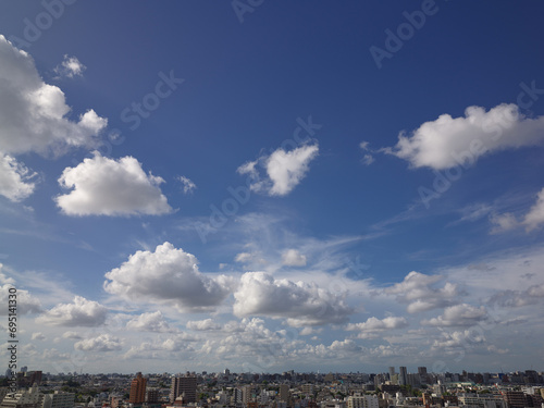 White clouds are spreading over the city in the blue Image taken on 2023/08/23 15:20 photo