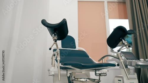 Gynecological chair with a screen in the medical office of the antenatal clinic in private clinic photo