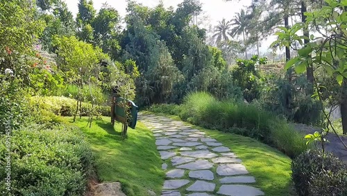 View of botanical garden with walking paths. Outdoors.