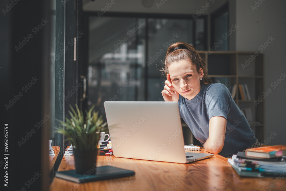 Overworked businesswoman suffering from headache and thinking how to end work. Overworked businesswoman suffering from headache and thinking how to end work.