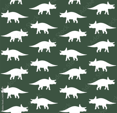 Vector seamless pattern of triceratops dinosaur silhouette isolated on green background