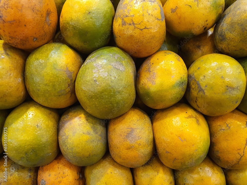 Close up pile of tasty fresh oranges sold at the market as a background. Close up pile of tasty fresh oranges sold at the market as a background.