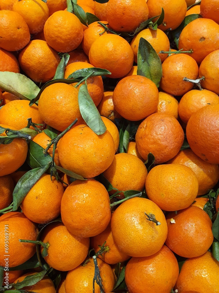 Close up pile of tasty fresh oranges sold at the market as a background. Close up pile of tasty fresh oranges sold at the market as a background.