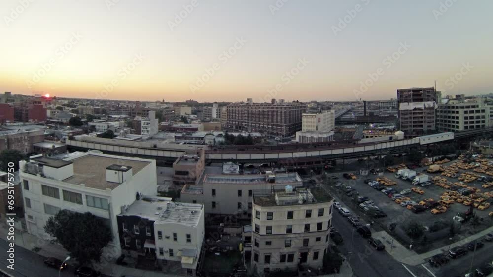 Cityscape with taxi parking and subway station during sunrise Cityscape with taxi parking and subway station during sunrise