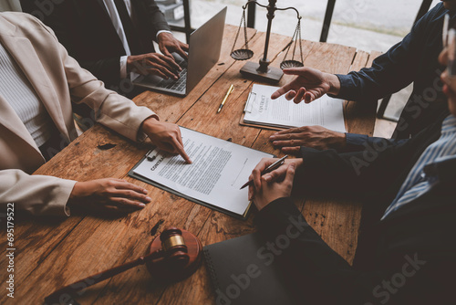 A lawyer, investor, businessman, entrepreneur is reviewing a business contract or insurance contract for future benefits or a businessman signs a document and receives a loan to start a new business.