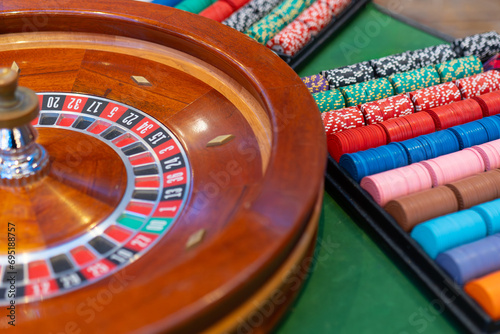 Thrilling casino moment: the classic roulette wheel spins on an elegant table, capturing the excitement of high-stakes gaming in sophisticated surroun
