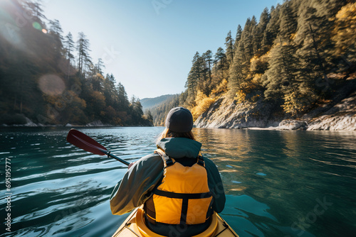 woman canoeing on the calm waters of the lake