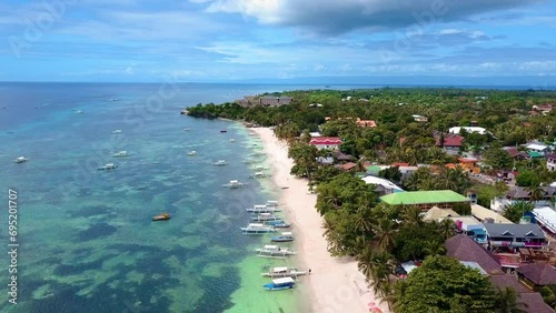 Scenic Aerial Panorama Drone Video of the White Sand Beach of Alona Bach in Panglao, Bohol,. Philippines photo