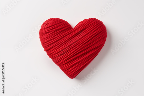 Top view of a red heart made of threads on a white isolated surface. Valentine s Day concept. Generative AI
