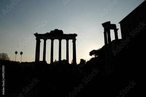 ruin of the Temple of Saturn in rome at night photo