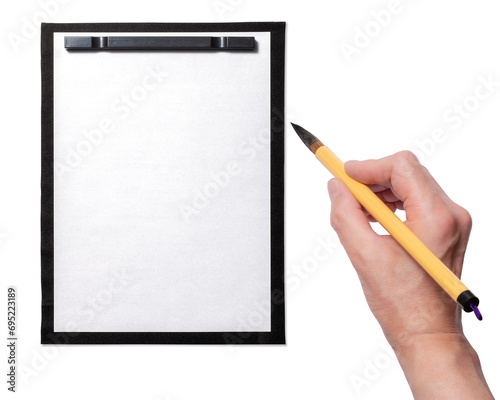 空白の半紙、筆を持つ手。書道、習字のイメージ photo
