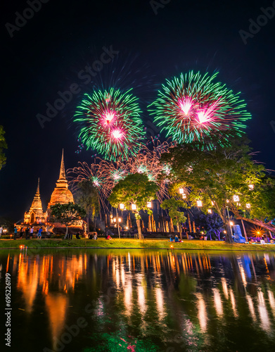 Beautiful Firework scene light color Sukhothai Co Lamplighter Loy Krathong Festival party at The Sukhothai Historical temple park covers the ruins of Sukhothai, in what is now Northern Thailand. photo