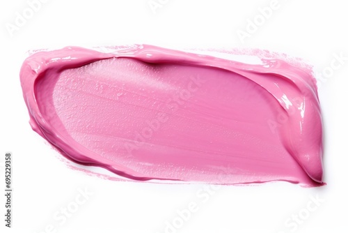 Pink lip gloss texture isolated on white background. Smudged cosmetic product smear. Make-up swatch product sample photo