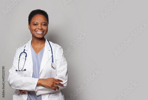Confident happy doctor woman medical worker in lab coat on white background photo