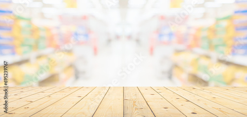 Empty wood table top with spet food shop blurred background photo