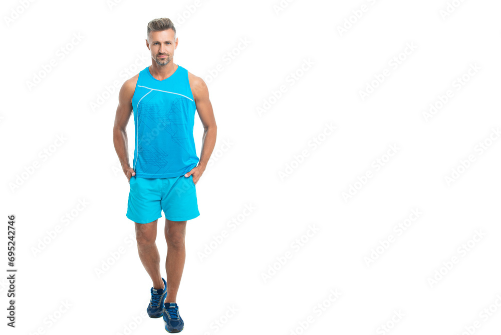 sport athlete posing on studio banner. sport athlete with fit body isolated against white. Sport and healthy lifestyle. full length of athlete. confident athlete wearing sport wear standing alone sport athlete posing on studio banner. sport athlete with fit body isolated against white. Sport and healthy lifestyle. full length of athlete. confident athlete wearing sport wear standing alone