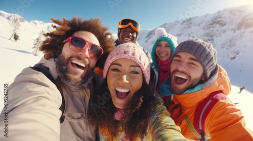 Group of friends capturing a moment with a selfie in the snowy landscape. Suitable for winter activities and friendship themes